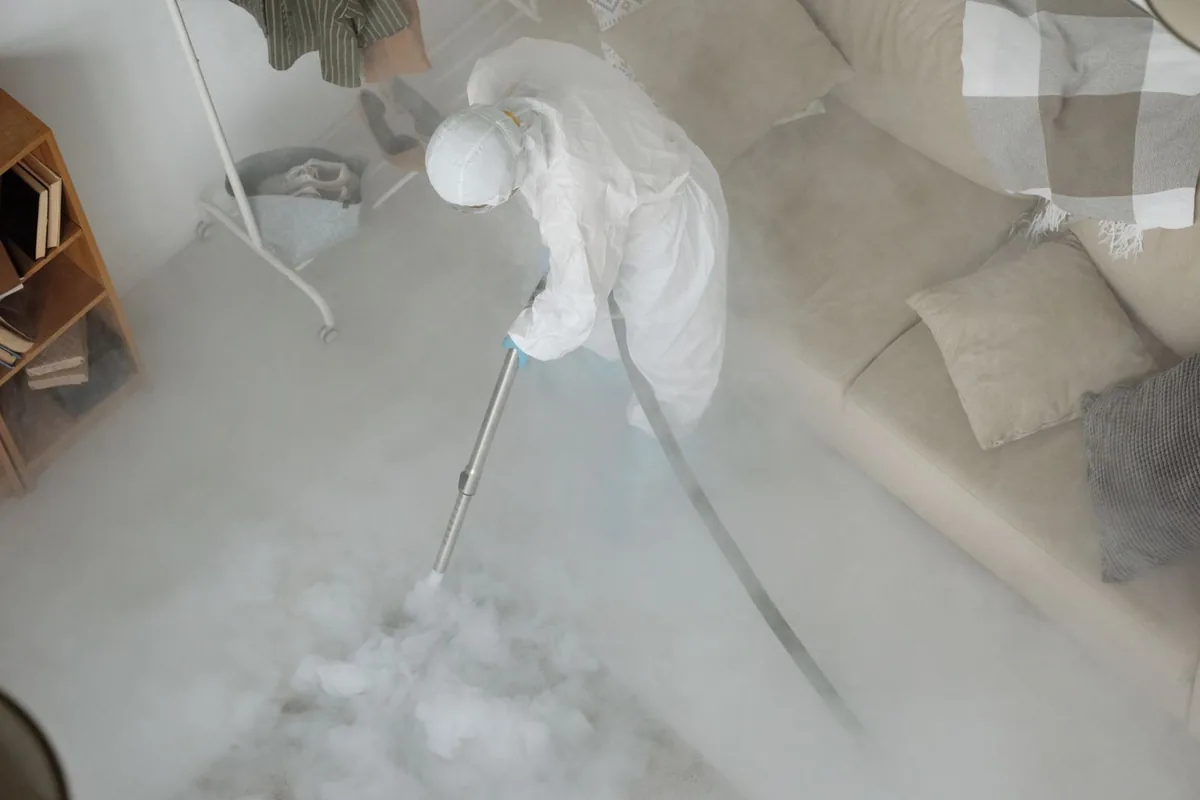Biohazard cleanup technician in protective equipment, Lewisburg, OH